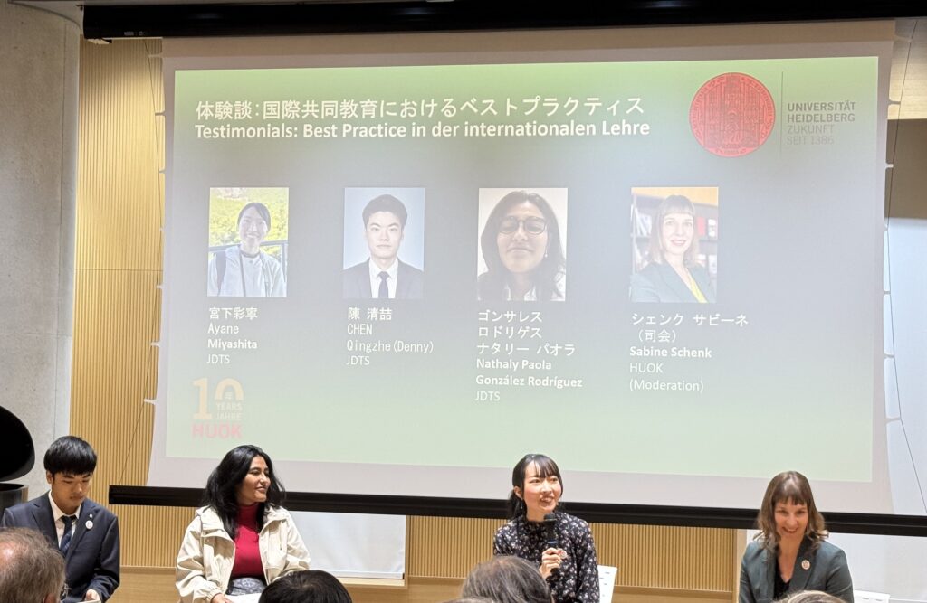 Panel with seated students discussing.